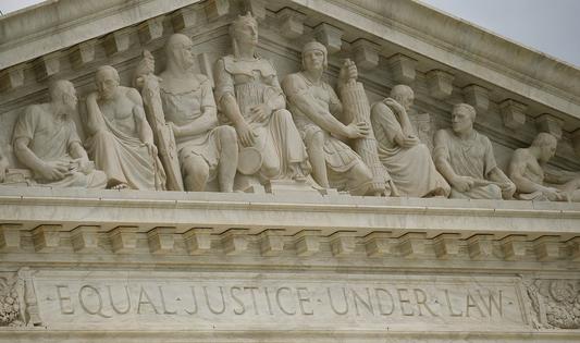 Carving's on the front of the U.S. Supreme Court building reads 