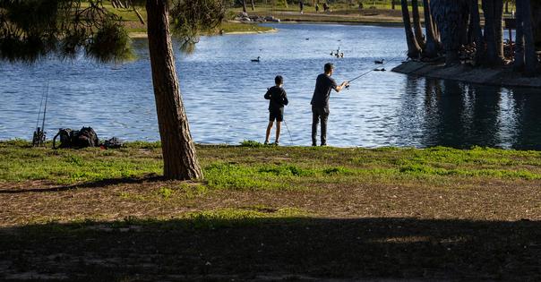 Fishing is recreational, but it's also an inexpensive way to add protein to people's diets. Allen J. Schaben / Los Angeles Times via Getty Images