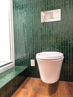This sleek wall-hung toilet is in a basement bathroom, not a fancy hotel. (Tim Carter/Tribune Content Agency/TNS)
