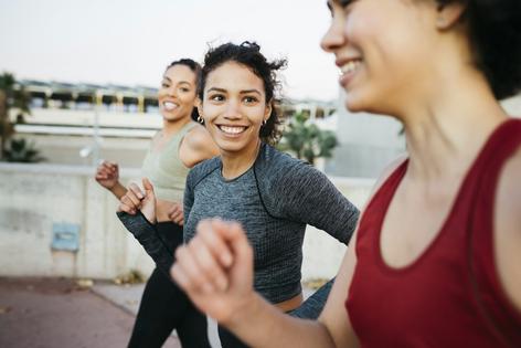 Research shows that doing exercise around other people improves your chances of sticking with it. Jordi Salas/Moment via Getty Images