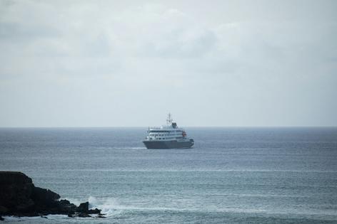 The cruise ship MV Hondius sits anchored off Praia, the capital of Cape Verde, on May 5, 2026, before setting course for Spain on May 6.   AFP via Getty Images