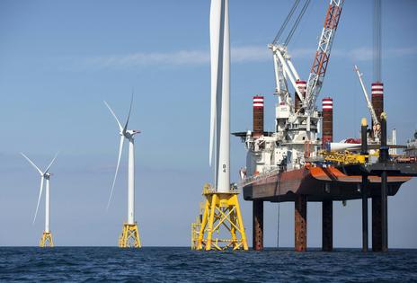 Wind farm construction means jobs and locally produced power. AP Photo/Michael Dwyer
