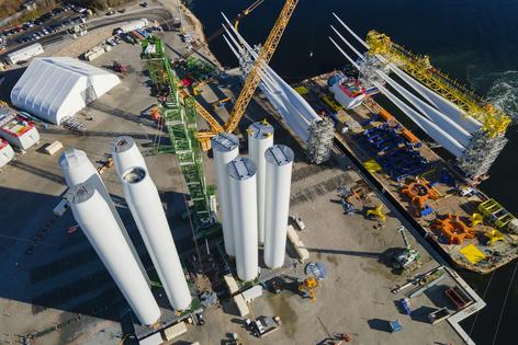 Offshore wind farms bring jobs and economic development. State Pier in New London, Conn., serves as a staging site for wind farm construction and supplies.
              AP Photo/Ted Shaffrey