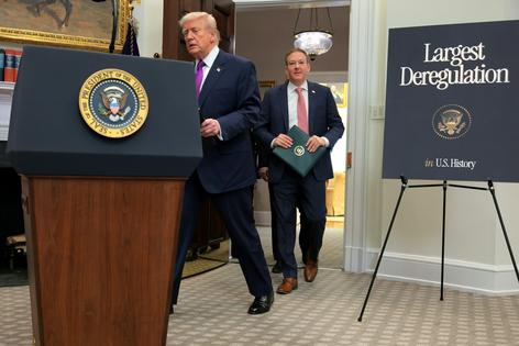 President Donald Trump and U.S. Environmental Protection Agency Administrator Lee Zeldin arrive for a White House event to announce a rollback of the 2009 Endangerment Finding on Feb. 12, 2026.
              Anna Moneymaker/Getty Images