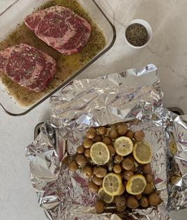 Foil-wrapped packets of small new potatoes go first on the grill. (JeanMarie Brownson/TCA)