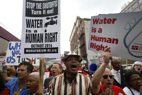 In 2014, demonstrators gathered to protest the city’s widespread water shutoffs, which left thousands of Detroit residents without water due to unpaid bills.
              Photo by Joshua Lott/Getty Images
