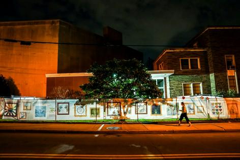 A fence outside the Tree of Life synagogue, site of the 2018 mass killing, holds artwork from schoolchildren on April 21, 2003, in Pittsburgh, Pa.
Jahi Chikwendiu/The Washington Post via Getty Images