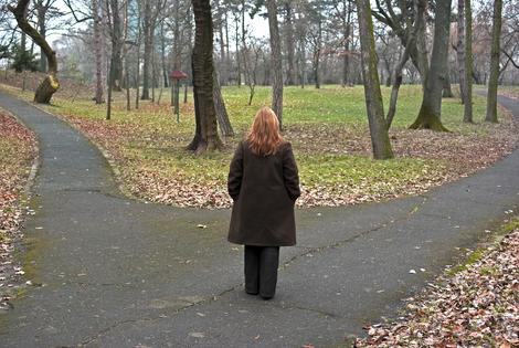 Woman approaching a crossroad, concept of decision process. Dreamstime/TCA