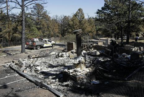 Wildfires like the one in Fourmile Canyon, Colo., in 2010, have been made more likely and worse by greenhouse gas emissions, which increase air temperatures and dry out vegetation.
              AP Photo/Jae C. Hong