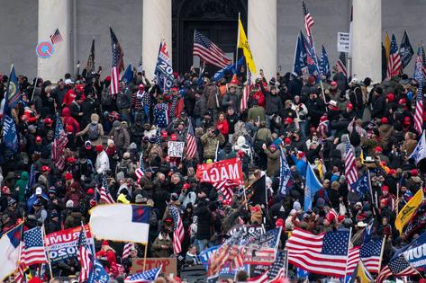 Donald Trump-aligned rioters take over the steps of the Capitol on Jan. 6, 2021, as Congress works to certify the Electoral College votes.
Bill Clark/CQ-Roll Call, Inc via Getty Images