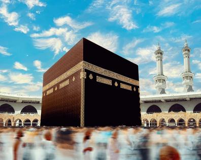 During the Hajj pilgrimage, Muslims go around the cube-like sacred structure, the Kaaba, which is covered with a black cloth, the kiswah. MASTER/Moment via Getty Images