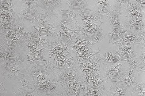 The textured topcoat creates a decorative finish with swirls and stippling effects that call attention to the ceiling. (Dreamstime/TCA)