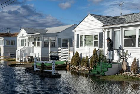 Water rises toward homes in Hampton, New Hampshire, on Jan. 10, 2024, after a storm with high winds, heavy rain and high seas.
Joseph Prezioso/AFP via Getty Images