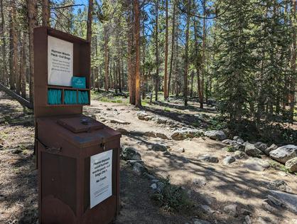 A kiosk offers free wag bags at the beginning of the Mount Elbert summit trail near Leadville, Colo. Wag bags are commonly used by hikers as self-contained receptacles for feces.
Shari Edelson, CC BY-ND