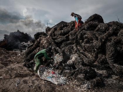 Workers prepare to burn imported plastic waste at a dump in East Java, Indonesia, in 2018. Ulet Ifansasti/Getty Images