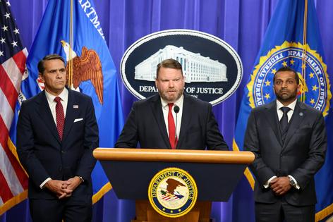 Ellis Boyle, U.S. attorney for the Eastern District of North Carolina, is flanked by acting Attorney General Todd Blanche, left, and FBI Director Kash Patel at a press conference on April 28, 2026, concerning charges against James Comey.
              Tasos Katopodis/Getty Images