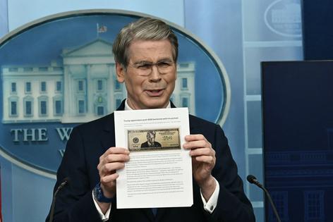 U.S. Secretary of Treasury Scott Bessent shows a proposed $250 bill featuring President Donald Trump during a news briefing in the Brady Briefing Room of the White House in Washington, D.C., on Thursday, May 28, 2026. (Kent Nishimura/AFP/Getty Images/TNS)