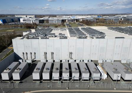 A row of generators sits alongside a data center building in northern Virginia.
Andrew Caballero-Reynolds/AFP via Getty Images
