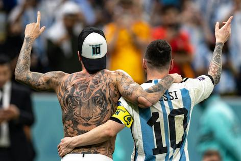 Argentina’s Rodrigo De Paul, left, and Lionel Messi at Lusail Stadium in Lusail City, Qatar, on Dec. 9, 2022, with their tattoos visible.
Simon Bruty/Anychance/Getty Images