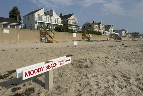 Waterfront property owners in Wells, Maine, have for years marked the beach extending from their property as private.
Gregory Rec/Portland Press Herald via Getty Images