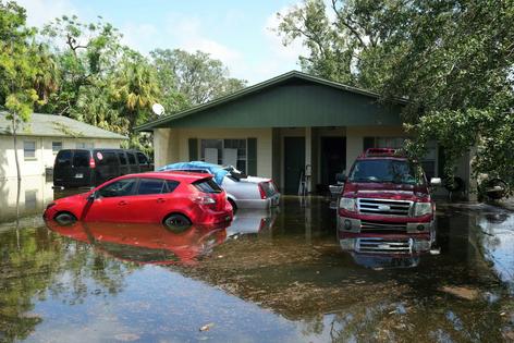 For some, the emotional and financial burden of cleaning up and rebuilding after hurricane season is simply too much.
Bryan R. Smith/AFP via Getty Images