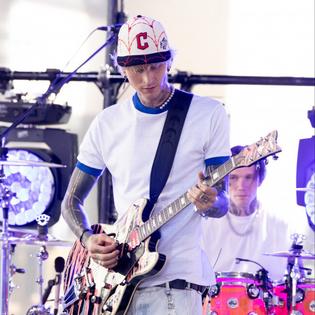 Bang Showbiz / MGK got sick while getting his blackout tattoo