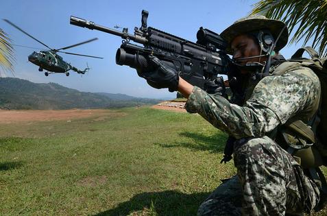 Peruvian army personnel during operations against alleged drug trafficking. Cris Bouroncle/AFP via Getty Images, CC BY