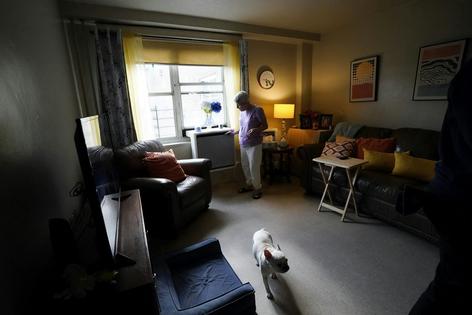 The New York City Housing Authority has been installing window-mounted heat pumps in apartments, like this one in Queens.
              AP Photo