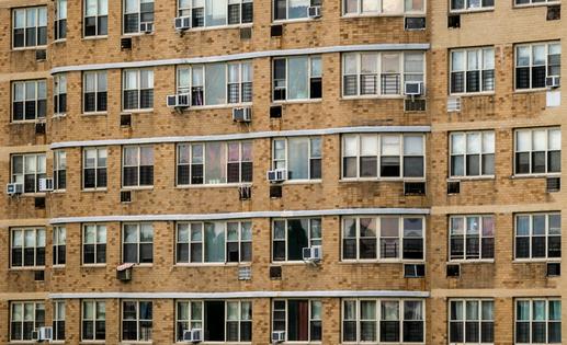 Many U.S. apartments have individual heating and cooling systems that are less efficient than current technology. Spencer Platt/Getty Images