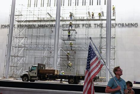WASHINGTON, DC - JUNE 13: Demonstrators sit outside The Kennedy Center on June 13, 2026 in Washington, DC. Friday marks the court-ordered deadline to remove President Donald Trump's name from the Kennedy Center. (Photo by Tasos Katopodis/Getty Images)