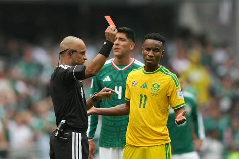 Referee Wilton Sampaio, of Brazil, shows the red card to South Africa’s Themba Zwane during the match between Mexico and South Africa on June 11, 2026.
              AP Photo/Silvia Izquierdo