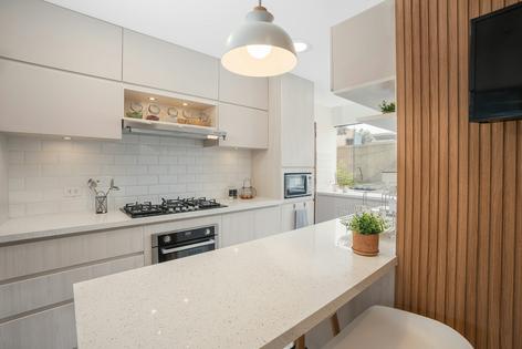Engineered stone, also called quartz, has become the most popular material for kitchen countertops. Guillermo Spelucin Runciman/iStock/Getty Images Plus