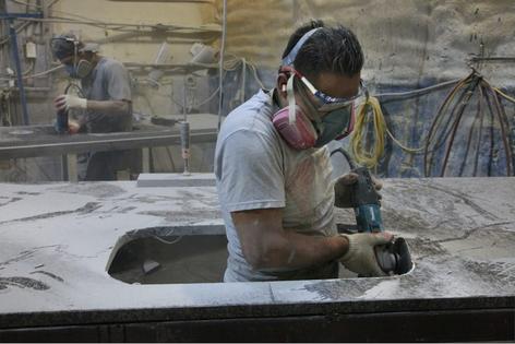 Fabrication workers who grind and polish countertops made of quartz inhale crystalline silica particles that cause silicosis.
              Earl Dotter, CC BY