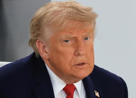 US President Donald Trump reacts during a working lunch meeting of G7 members, partner countries, and artificial intelligence business leaders as part of the G7 summit, in Evian, eastern France, on June 17, 2026. A G7 summit is set to take place June 15 to 17 in the French town of Evian-les-Bains near Switzerland and it will be attended by country leaders as well as the EU's foreign policy chief and ministers from Brazil, Canada, the United Arab Emirates and Turkey. (Photo by Ludovic MARIN / AFP via Getty Images)
