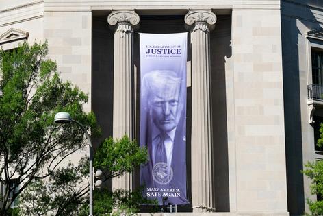 A Trump banner hangs on the Department of Justice building in Washington, D.C., on June 15, 2026.
Bill Clark/CQ-Roll Call, Inc via Getty Images