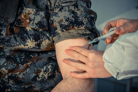 A military training base provides a prime environment for the influenza virus to spread.  Photographer and Illustrator/iStock via Getty Images Plus