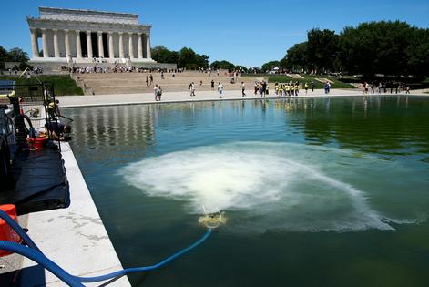 In addition to hydrogen peroxide and vacuums, the government ordered nanobubble ozone technology to break up the algae. The nanobubbler contract was for $1.7 million.
              AP Photo/Jacquelyn Martin