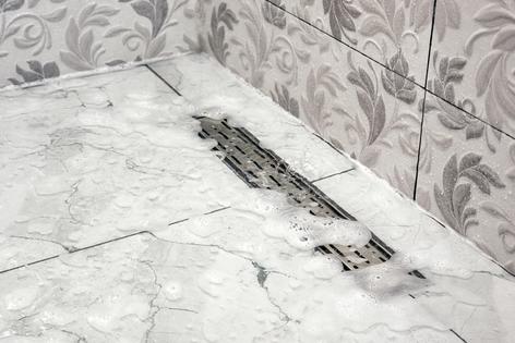 Linear drains are often not as efficient as point drains. (Dreamstime/TCA)