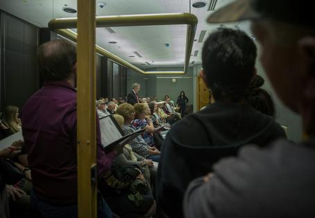 People packed a local meeting room in Evanston, Wyo., for a public hearing on a proposed data center.
Natalie Behring/Getty Images