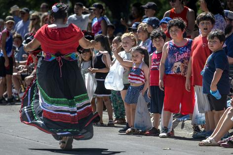Residents watch an Independence Day parade in Storm Lake, Iowa, where about 40% of the population claims Hispanic heritage.
Scott Olson/Getty Images