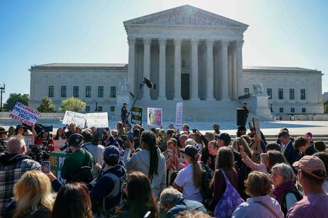 A crowd demonstrates at the Supreme Court in favor of consumer protections on April 27, 2026.
              Tasos Katopodis/Getty Images