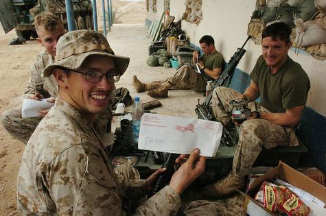 U.S. Marines in Iraq hold voting materials received by mail in 2004. Overseas voters often mail ballots weeks before Election Day to meet deadlines.
Scott Peterson/Getty Images