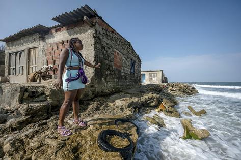Sea level is inching up on homes on Tierra Bomba Island, Colombia, where a cemetery already washed away.
              Luis Acosta/AFP via Getty Images