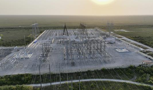 Someone has to pay for substations and other electricity transmission equipment – but who, and how much?
              Joe Raedle/Getty Images