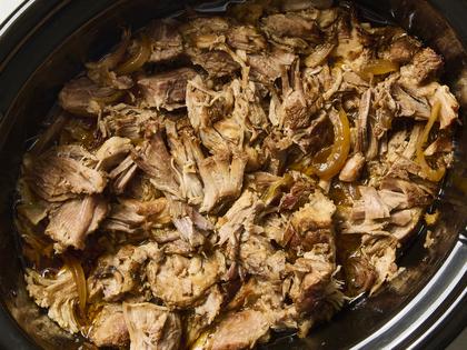 A can of soda and a few flavorful ingredients are all you need for the perfect slow-cooker pulled pork. (Alex Lepe/TCA)