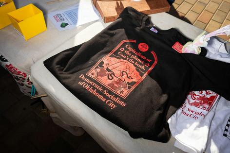 A T-shirt for sale at the Oklahoma City Free America Walkout on Jan. 20, 2026.
              Brett Deering/Getty Images for Women's March