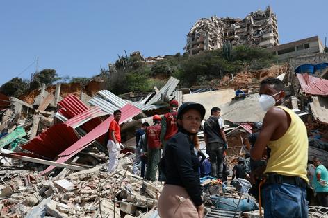 In the days immediately following the earthquakes, neighbors came together to search for survivors. picture alliance/picture alliance via Getty Images