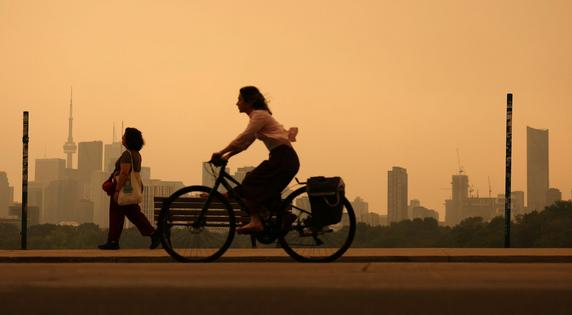 Heavy wildfire smoke from Canada's forests turn skies orange in Toronto and across parts of the U.S. in July 2026. Steve Russell/Toronto Star via Getty Images