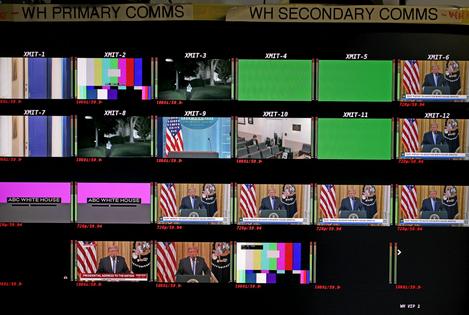 Screens in the James S. Brady Press Briefing Room show President Donald Trump delivering a primetime address on July 16, 2026, during which the White House unveiled a collection of declassified documents. Alex Wong/Getty Images