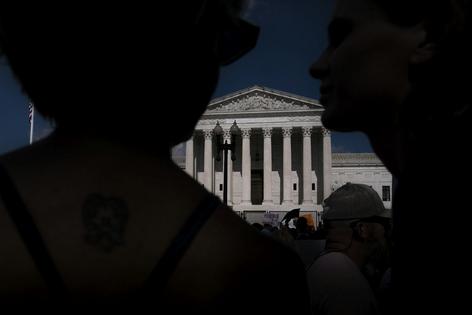 People gather in front of the Supreme Court building following the Dobbs v. Jackson Women's Health Organization ruling on June 24, 2022, in Washington, D.C. Nathan Howard/Getty Images